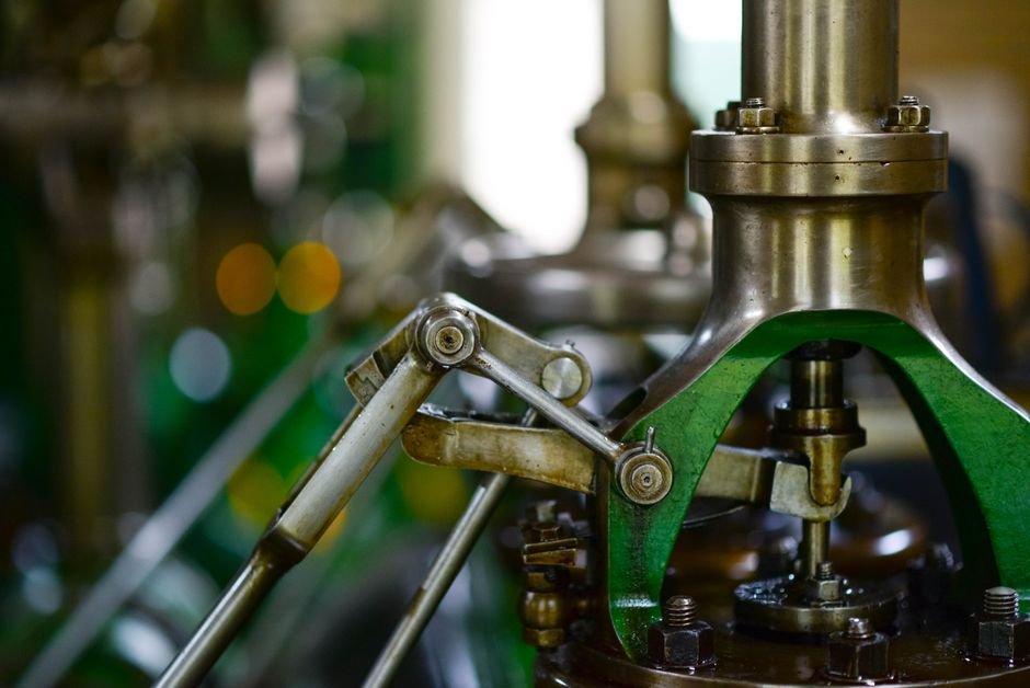 Mechanical engineering components including gears and levers in an industrial setting