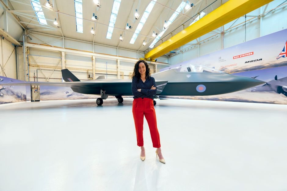 An aerospace engineer inspecting an aircraft at a research facility